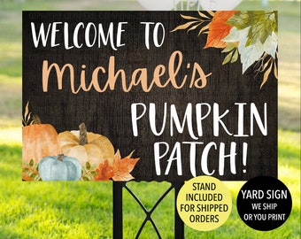 May include: A black and white yard sign with a rustic wood background. The sign says "Welcome to Michael's Pumpkin Patch!" with a fall-themed illustration of pumpkins and leaves. The sign includes the text "Stand Included for Shipped Orders" and "Yard Sign We Ship or You Print".
