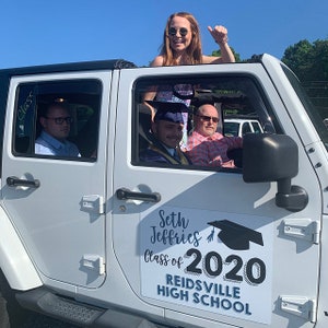 May include: A white Jeep with a sign that reads "Seth Jeffries Class of 2020 Reidsville High School". Four people are in the Jeep, including a graduate wearing a cap and gown.