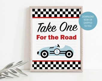 May include: Framed print with a light blue race car illustration and the text "Take One For the Road" in black and red. The design includes a checkered flag pattern and is suitable for a nursery or child's room.