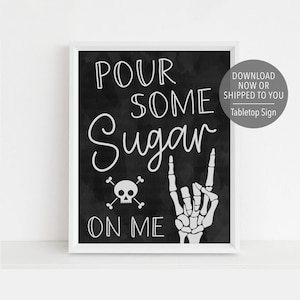 May include: Black and white printable sign with the text "Pour some sugar on me" with a skull and crossbones and a skeleton hand making a rock and roll sign.  The sign is framed in a white frame.