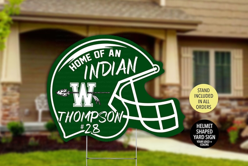 May include: Green and white helmet shaped yard sign with the text "Home of an Indian" and a large "W" with an arrow through it. The text "Thompson #28" is below the "W".