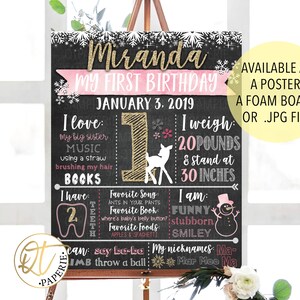 May include: A chalkboard style first birthday sign with a pink and gold theme. The sign says "Miranda My First Birthday" and includes details like "I love: my big sister, music, using a straw, brushing my hair, books", "I have: 2 teeth", "I weigh: 20 pounds & stand at 30 inches", "I am: funny, stubborn, smiley", and "My nicknames: Ma-Mar Moo Ma".