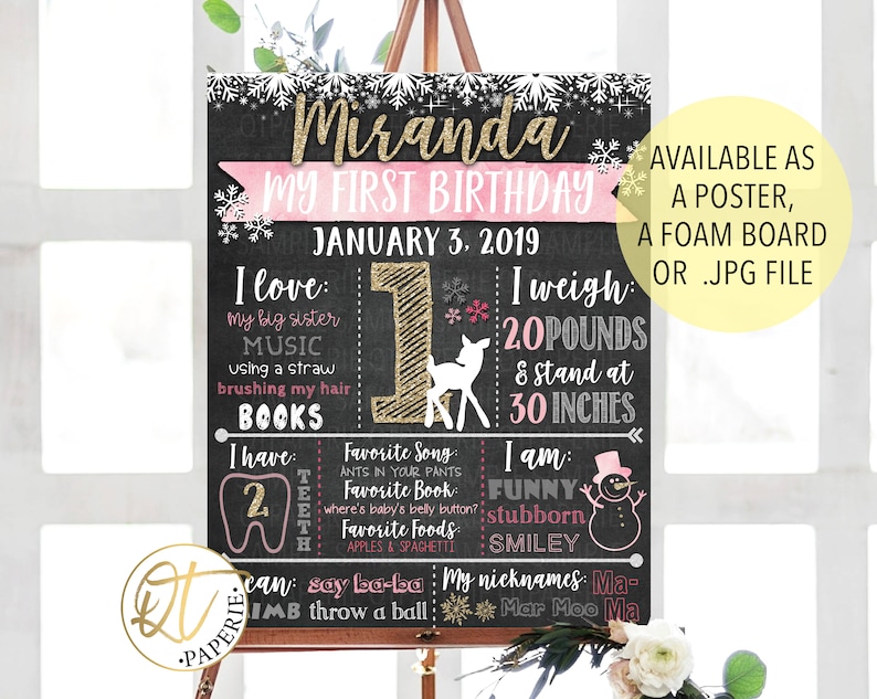 May include: A chalkboard style first birthday sign with a pink and gold theme. The sign says "Miranda My First Birthday" and includes details like "I love: my big sister, music, using a straw, brushing my hair, books", "I have: 2 teeth", "I weigh: 20 pounds & stand at 30 inches", "I am: funny, stubborn, smiley", and "My nicknames: Ma-Mar Moo Ma".