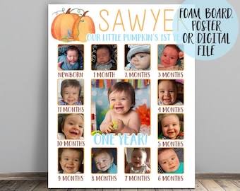 May include: A pumpkin-themed first birthday photo sign with a grid of 12 photos of a baby boy, each photo representing a different month of the baby's first year. The sign is decorated with a pumpkin and leaves and the text "Sawyer, Our Little Pumpkin's 1st Year".