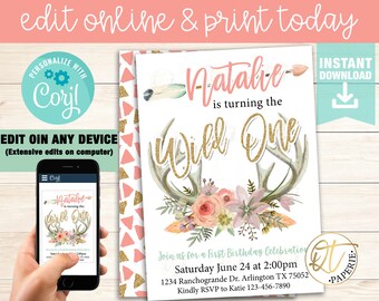 May include: A printable invitation for a first birthday party with a woodland theme. The invitation features a gold glitter "Wild One" text, a deer antler with floral accents, and a pink and gold geometric pattern in the background. The text on the invitation reads "Natalie is turning the Wild One. Join us for a First Birthday Celebration. Saturday June 24 at 2:00pm. 1234 Ranchogrande Dr. Arlington TX 75052. Kindly RSVP to Katie 123-456-7890."