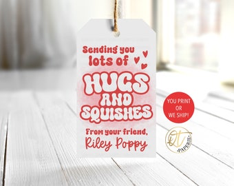 May include: White gift tag with red text that says "Sending you lots of hugs and squishes from your friend, Riley Poppy". The tag has a red heart design and a red circle with the text "You print or we ship!"