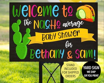 May include: A black yard sign with colorful text that reads "Welcome to the Nacho average Baby Shower for Bethany & Sam!" A green cactus and a taco graphic are also featured. The sign is on a black metal stand.