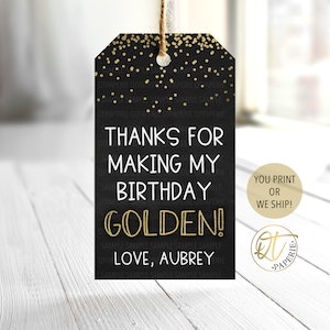 May include: Black and gold thank you tag with gold confetti. The tag says "Thanks for making my birthday golden! Love, Aubrey".