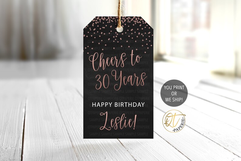 May include: A black and rose gold printable gift tag with confetti and the text "Cheers to 30 Years Happy Birthday Leslie!"
