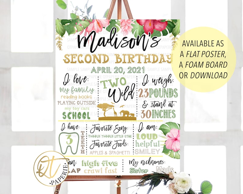 May include: A green, yellow, and pink jungle-themed birthday sign for a child turning two. The sign says "Madison's Second Birthday" and includes details like "I love: my family, reading books, playing outside, my toy cars, school", "I weigh: 23 pounds and stand at 30 inches", "I have: 3 teeth", "Favorite song: Twinkle Twinkle Little Star", "Favorite foods: Apples & Spaghetti", "I am: Loud, Helpful, Smiley", "My nicknames: Sister, Mads".