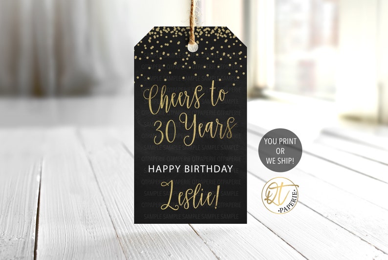 May include: Black and gold printable gift tag with gold confetti and the text "Cheers to 30 Years Happy Birthday Leslie!" You Print or We Ship! DT Paperie.