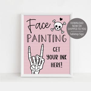 May include: A pink printable sign with a skull and crossbones, a skeleton hand making a rock and roll sign, and the text "Face Painting Get Your Ink Here!"  Download now or shipped to you. Tabletop sign.