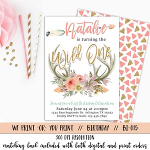 May include: A printable invitation for a first birthday party with a pink and gold color scheme. The invitation features a floral design with antlers and the text "Natalie is turning the Wild One".