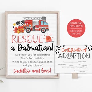 May include: A framed print with the text "Rescue a Dalmatian!" and a cartoon Dalmatian firefighter on a red fire truck. Includes a "Certificate of Adoption" card and a red circle with text.