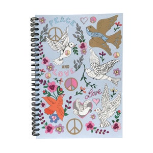 May include: A blue spiral notebook with a peace and love theme. The cover features white doves, peace signs, hearts, and flowers. The text "Peace and Love" is written in black.