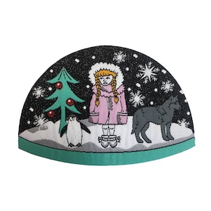 May include: A green Christmas tree with red baubles, a girl wearing a pink coat and a black and white penguin, and a black dog on a snowy background. The scene is surrounded by a green border.