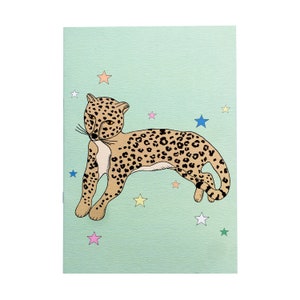 May include: A green card with a brown and black cheetah with black spots lying down on a green background with colourful stars.