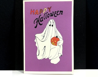 May include: A Halloween greeting card with a purple background. The card features a white ghost holding an orange jack-o'-lantern. The words "HAPPY Halloween" are written in a playful font above the ghost.