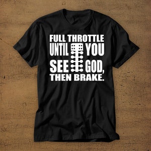 May include: Black t-shirt with white text that reads "Full Throttle Until You See God, Then Brake." The text includes a graphic of a racing car's gear shifter.