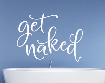 May include: White bathtub with a white "get naked" text decal on a blue wall.