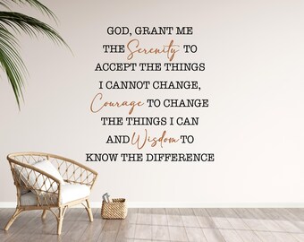 May include: A wall decal with the text "GOD, GRANT ME THE Serenity TO ACCEPT THE THINGS I CANNOT CHANGE, Courage TO CHANGE THE THINGS I CAN AND Wisdom TO KNOW THE DIFFERENCE." A wicker chair and basket are in the foreground.