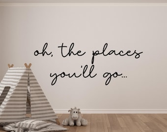 May include: A nursery wall decal with the quote "oh, the places you'll go..." in black script. A striped teepee tent and stuffed animal are in the foreground. The room has a light-colored wall and hardwood floor.