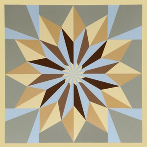May include: A geometric abstract art print with a starburst design in shades of brown, beige, and blue.