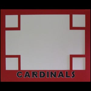 May include: A rectangular red photo mat with a white core featuring five cutouts for photographs. The mat includes a large central opening flanked by four smaller square openings. The word CARDINALS is printed in black capital letters at the bottom.
