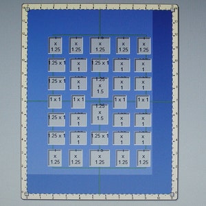 May include: A blue grid with white squares containing measurements in inches. The grid is divided into rows and columns, with each square representing a different size. The measurements are in inches, with the smallest square being 1 x 1 inch and the largest square being 1.25 x 1.5 inches.