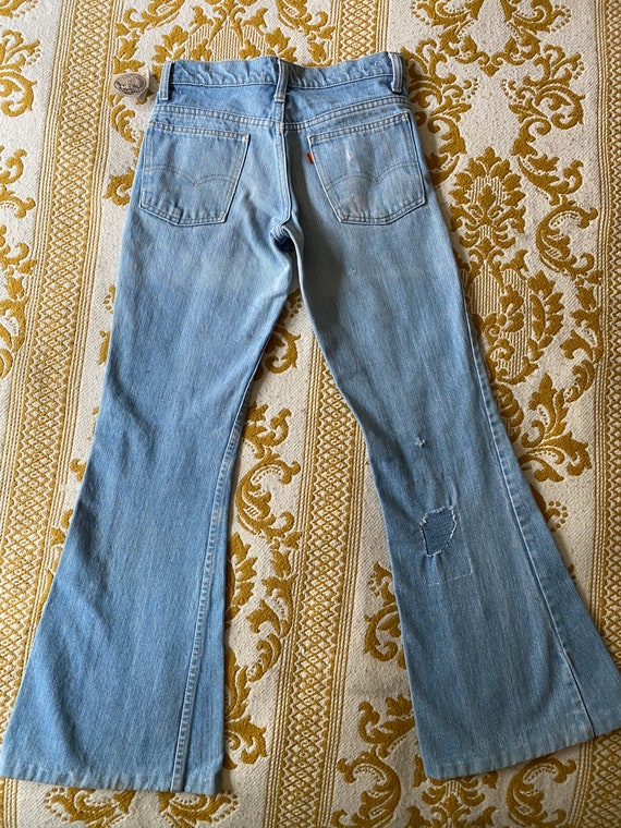 Levi’s Orange Tab Bell bottoms with small denim pa