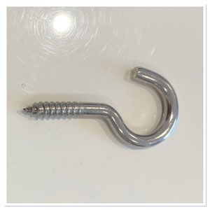 May include: A silver screw-in hook with a rounded hook end and a threaded screw end.