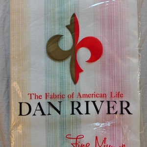 May include: A package of two Dan River pillowcases. The pillowcases have vertical stripes in shades of yellow, green, and pink. The package features a logo with a red and gold design and the text "The Fabric of American Life."