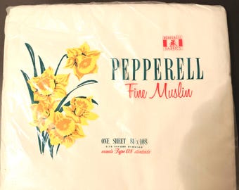 May include: A package of Pepperell Fine Muslin bed sheet featuring a yellow daffodil graphic. The text reads Pepperell Fabrics, Fine Muslin, One Sheet 81 x 108, Size Before Hemming, exceeds Type 128 standards. The item is in plastic.
