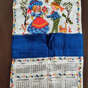 Vintage 1975 calendar tea towel repurposed with little hand sewn pockets