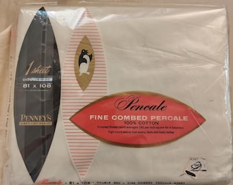 May include: A white Penney's Fine Combed Percale 100% cotton double bed sheet in original plastic packaging. The label features a penguin graphic, the text 1 sheet, 81 x 108 inches, and states the thread count averages 186 per inch square.