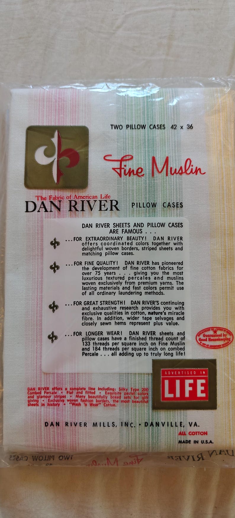 May include: Package of two Dan River pillow cases, 42 x 36 inches, in a striped pattern with pastel colors. The packaging features the "Fine Muslin" logo and text advertising the product's quality and durability.