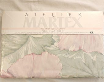 May include: A package of Atelier Martex full flat sheet made of 100% cotton. The packaging features the text 'ATELIER MARTEX NO IRON 100% COTTON FULL FLAT SHEET' and displays a floral pattern with large, soft pink petals and muted green leaves.