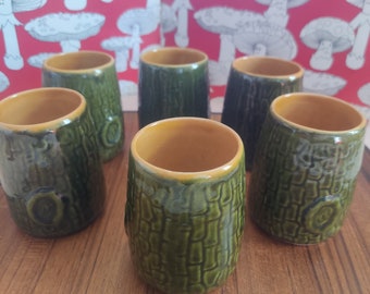 Six vintage stoneware ceramic teacups with bark and tree designs
