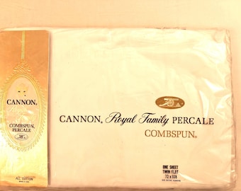 May include: A white Cannon Royal Family twin flat sheet in original plastic packaging. The label reads Cannon Royal Family Percale Combspun, One Sheet Twin Flat 72 x 108, and All Cotton Made in USA. The packaging features a gold vertical insert.