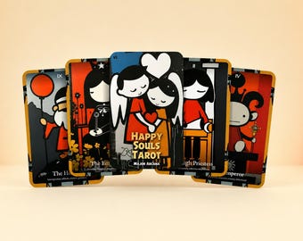 May include: A set of five rectangular tarot cards featuring stylized cartoon illustrations in black, white, red, and orange. The central card displays two figures embracing with a heart above them and the text Happy Souls Tarot Major Arcana.