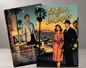 May include: A deck of tarot cards titled The Tarot of Los Angeles. One card shows a person with a suitcase and the text The Fool. The other card features a person in a trench coat and a person in a suit standing before a Hollywood landscape.