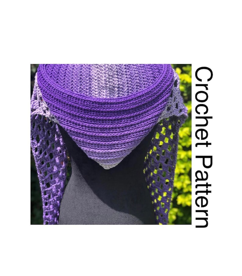 May include: A purple and grey crochet shawl with a lacy pattern. The shawl is draped over a mannequin. Crochet Pattern.
