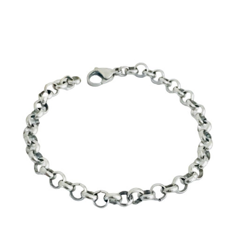 May include: A silver chain bracelet with a lobster clasp.