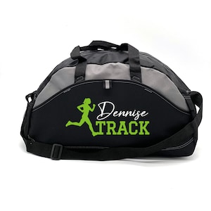 May include: Black and grey duffel bag with a green running silhouette and the text "Dennisse TRACK" embroidered on the front.