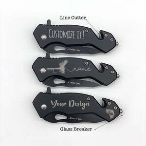 May include: Three black pocket knives with a glass breaker and line cutter. The top knife is engraved with "CUSTOMIZE IT!" The middle knife is engraved with a fly fishing lure and the word "name". The bottom knife is engraved with "Your Design" and a fish.