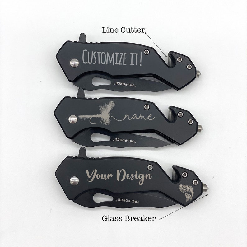 May include: Three black pocket knives with a glass breaker and line cutter. The top knife is engraved with "CUSTOMIZE IT!" The middle knife is engraved with a fly fishing lure and the word "name". The bottom knife is engraved with "Your Design" and a fish.