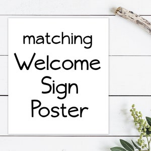 May include: White poster with black text that reads "matching Welcome Sign Poster".