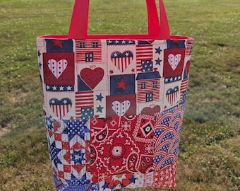 May include: A patriotic tote bag with a patchwork design featuring hearts, stars, and stripes in red, white, and blue. The bag has red handles and a red interior, perfect for carrying items.