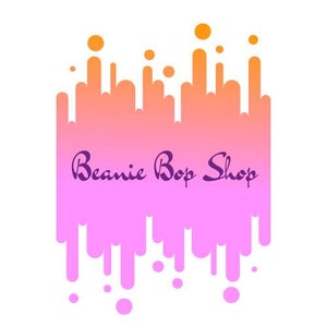 May include: A pink and orange abstract design with the text "Beanie Bop Shop" in purple cursive lettering.