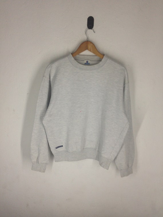 champion jumper small logo